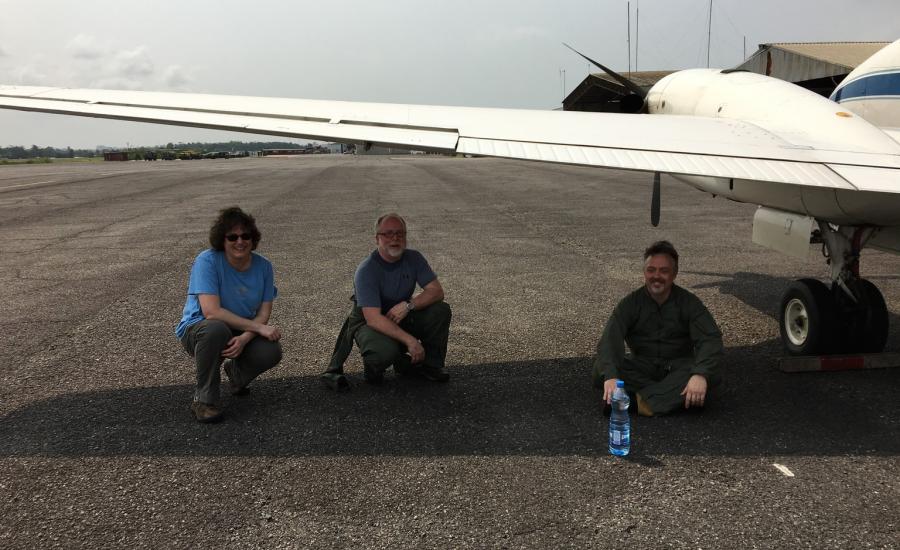 Michelle Hofton, Bryan Blair and David Rabine from the LVIS team cooling off under the B-200 wing.