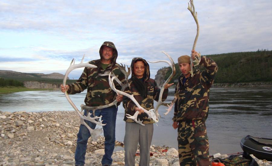 Members of the 2008 Siberian Forest Expedition (Ross Nelson, Guoqing Sun, and Paul Montesano) pose with reindeer antleers discovered along the Kotuykan River.