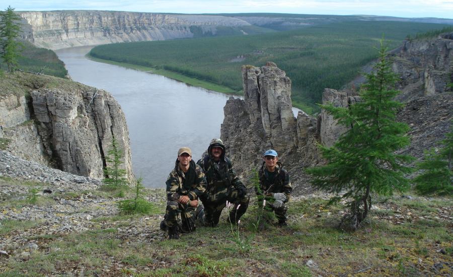 The view to the east as Paul Montesano, Jon, Ranson, and Guoqing Sun take a knee on the cliffs overlooking the confluence of the Kotuykan and Kotuy Rivers