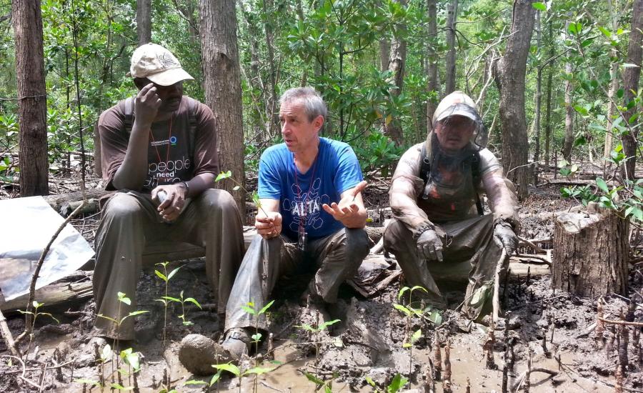 Discussing the issues of sampling in the illegally cut areas. Left to right: Drs. Mwita Mangora (University of Dar Es Salaam), Carl Trettin (USFS), and SeungKuk Lee (NASA/GSFC)